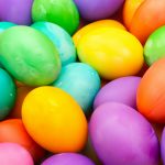 a pile of colorful eggs sitting on top of each other